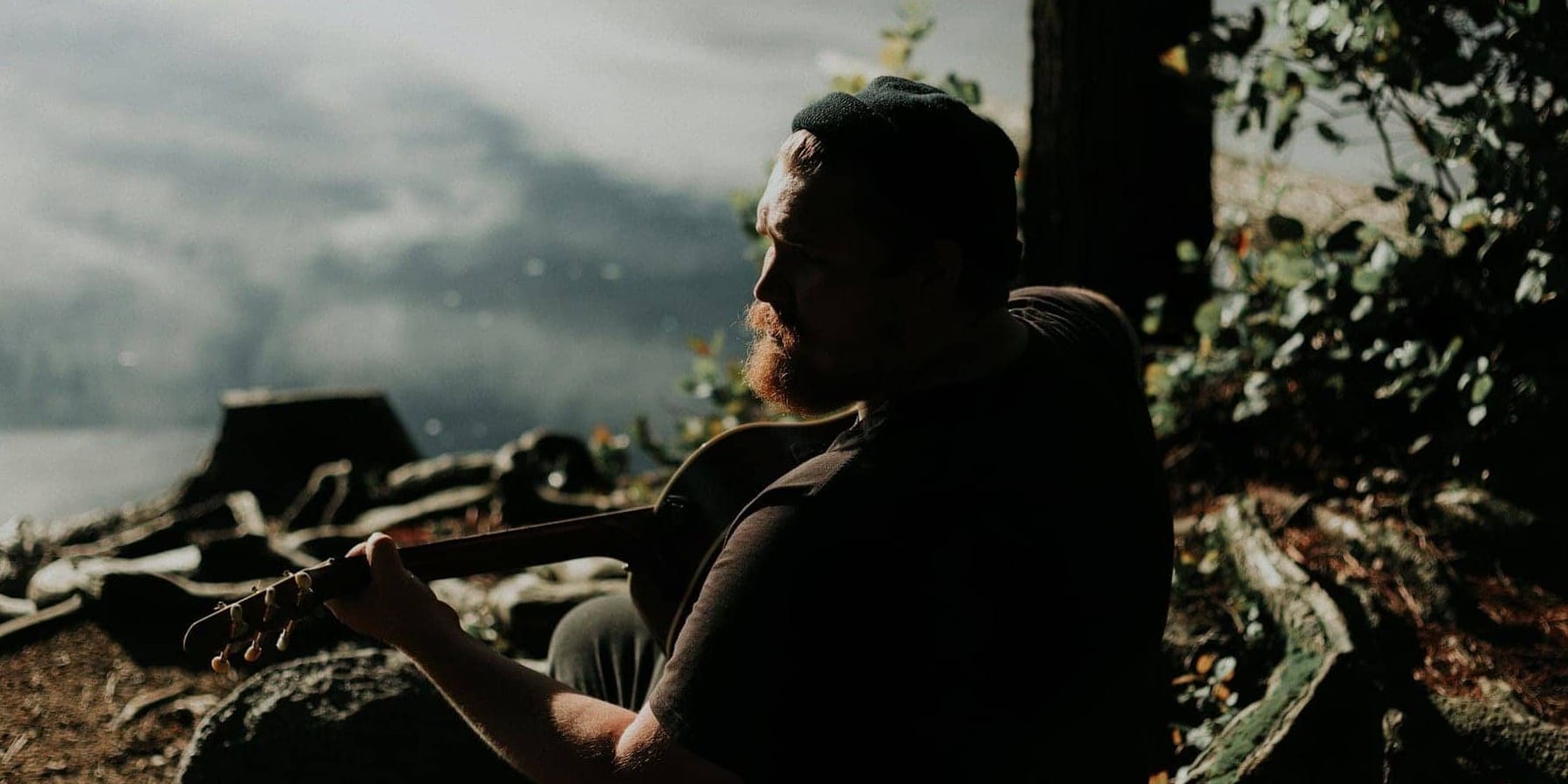 Guy in Therapy playing a guitar